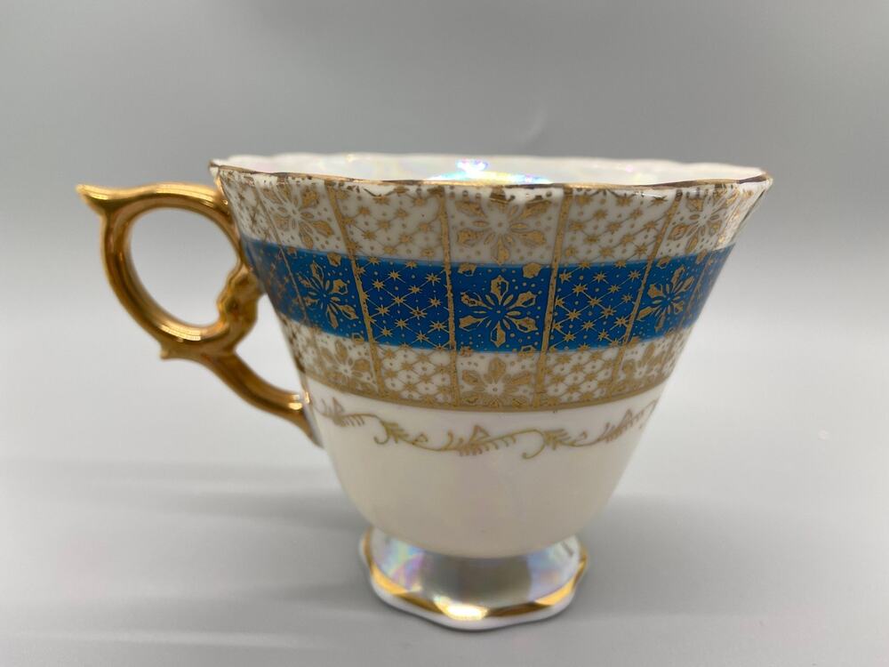 Vintage Porcelain Lusterware Tea Cup with Blue and Gold Toned Floral Design